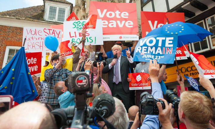 Boris Johnson is surrounded by Vote Leave and Vote Remain activists as he speaks in Winchester, as part of his tour on the Vote Leave campaign bus.