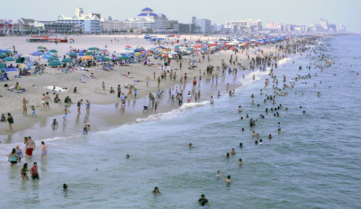 Sunbathers crowd the beach in Ocean City, Maryland. On Monday, police said they found a woman's body along the shore.