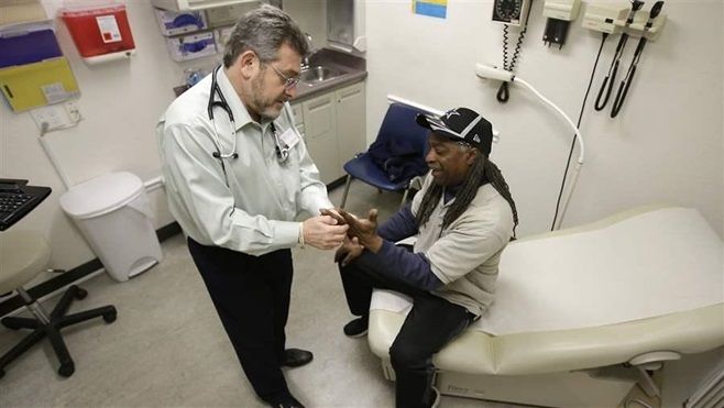 A doctor examines a patient in Sacramento, California. A bipartisan group of governors has proposed health care fixes to stabilize health insurance marketplaces, give states more control over their Medicaid programs and stem high drug prices.