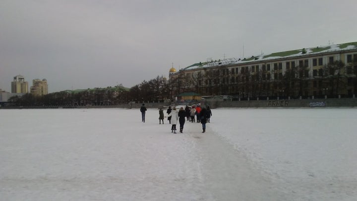 Students cross the frozen Iset River that runs through the city of Yekaterinburg in Western Siberia.