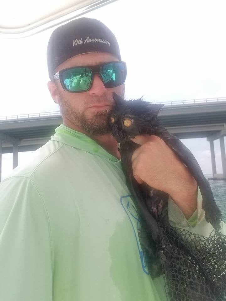 Jordan Smith and Miracle, shortly after he pulled the cat from the water.