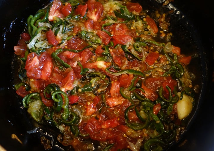 That chopped tomato goes in once the vegetables are thoroughly cooked