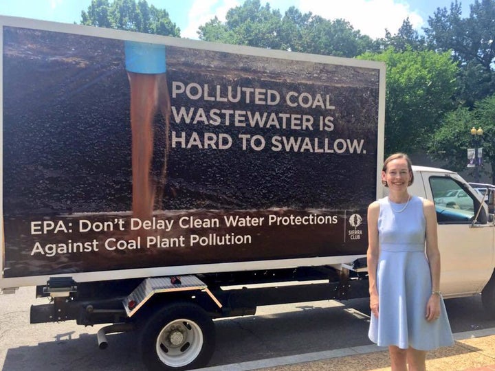 <p>Mary Anne Hitt in front of the mobile billboard at the EPA headquarters in Washington, DC, on the day of the hearing.</p>