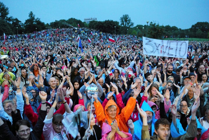 People attend a protest against judicial reforms in Poznan, Poland, July 24, 2017. 