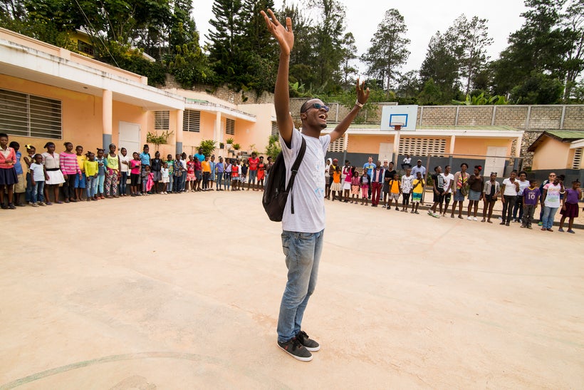 <strong>Alex Hercules, long time WWO staff leader helping to excite the crowd, Haiti (2016).</strong>