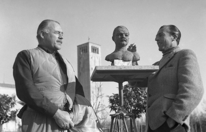 Ernest Hemingway posing for the sculptor Toni Lucarda, preparing a bust sculpture, in Torcello, Italy, 1948.