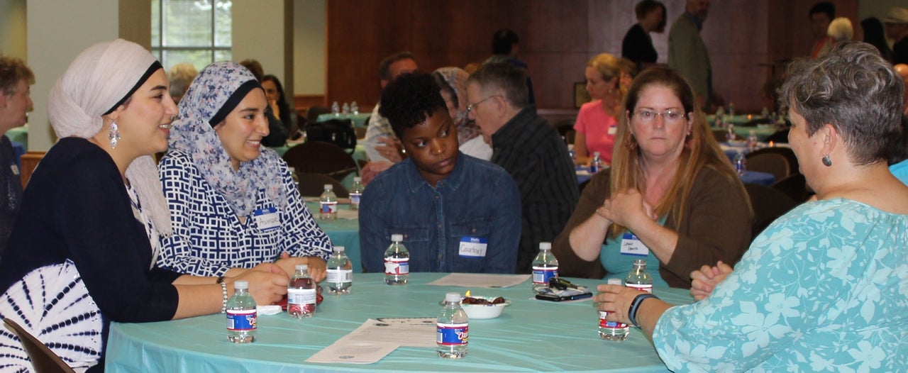 Community members at an interfaith iftar organized by Crescent Peace Society in June.