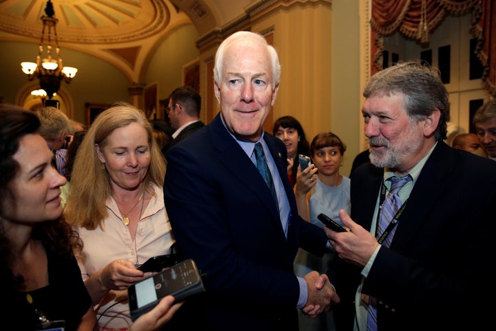 Reporters surround Sen. John Cornyn (R-Texas) ahead of a vote to repeal Obamacare. He’s probably telling them things are looking great.