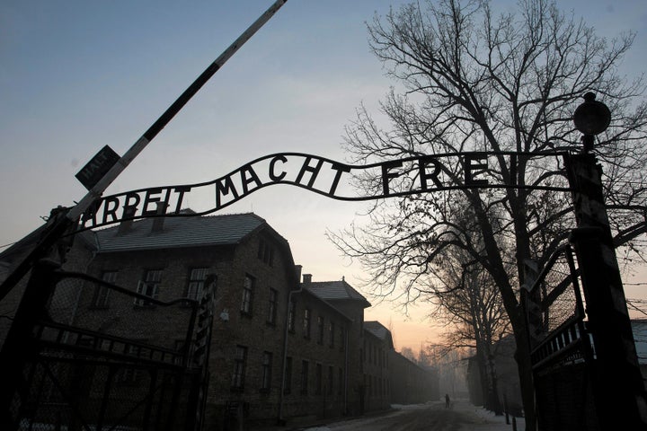 The Nazi slogan "Arbeit macht frei" (Work sets you free), displayed at the gates of the former Nazi concentration and extermination camp Auschwitz-Birkenau in Oswiecim, Poland.