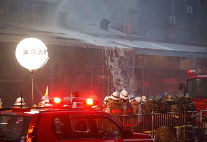 Firefighters battle the blaze at the world's largest fishmarket. 