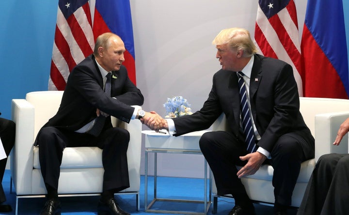 Russian President Vladimir Putin and U.S. President Donald Trump shake hands during a bilateral meeting on the sidelines of the G-20 summit in Hamburg, Germany, on July 7, 2017.