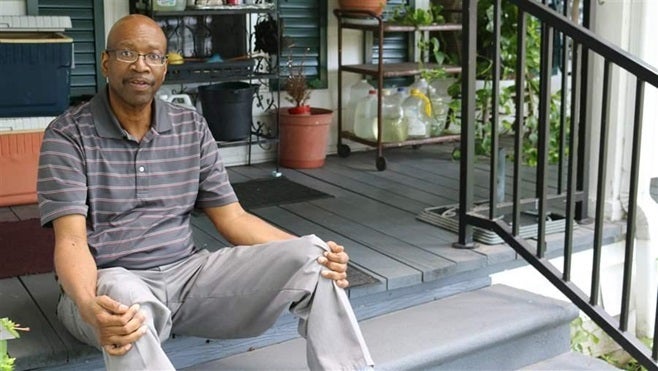 Lynn Graham sits on his porch in Redwater, Texas, after returning from an appointment at the closest U.S. Department of Veter