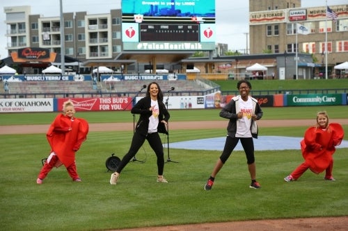 Triana, second from left, leading warm-up for 2017 Tulsa Heart Walk.