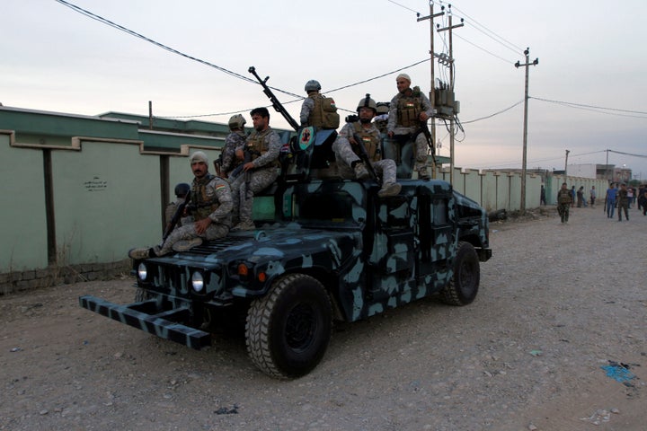 Iraqi Kurdish security forces patrol a street in the city of Kirkuk, Iraq. 