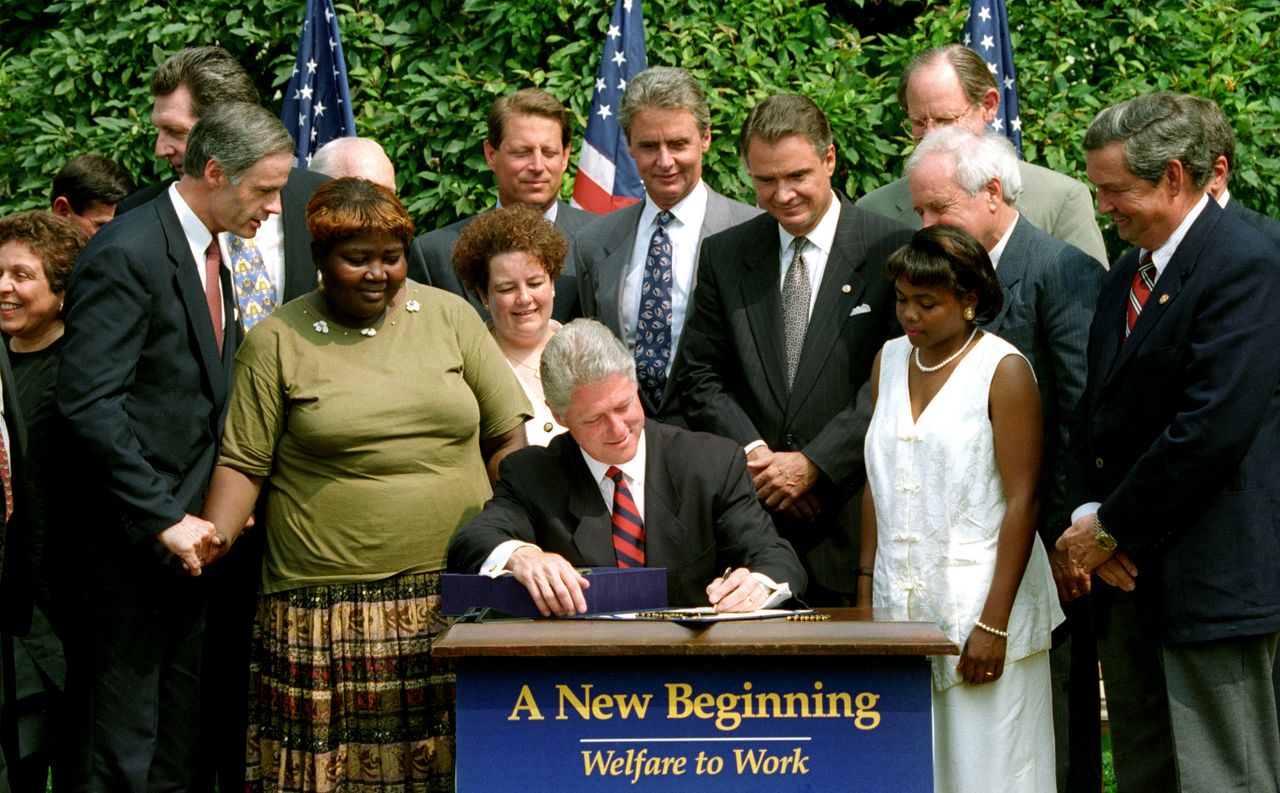 President Bill Clinton signs into law a welfare reform bill ending the 61-year federal guarantee of aid to the poor on Aug. 22, 1996.