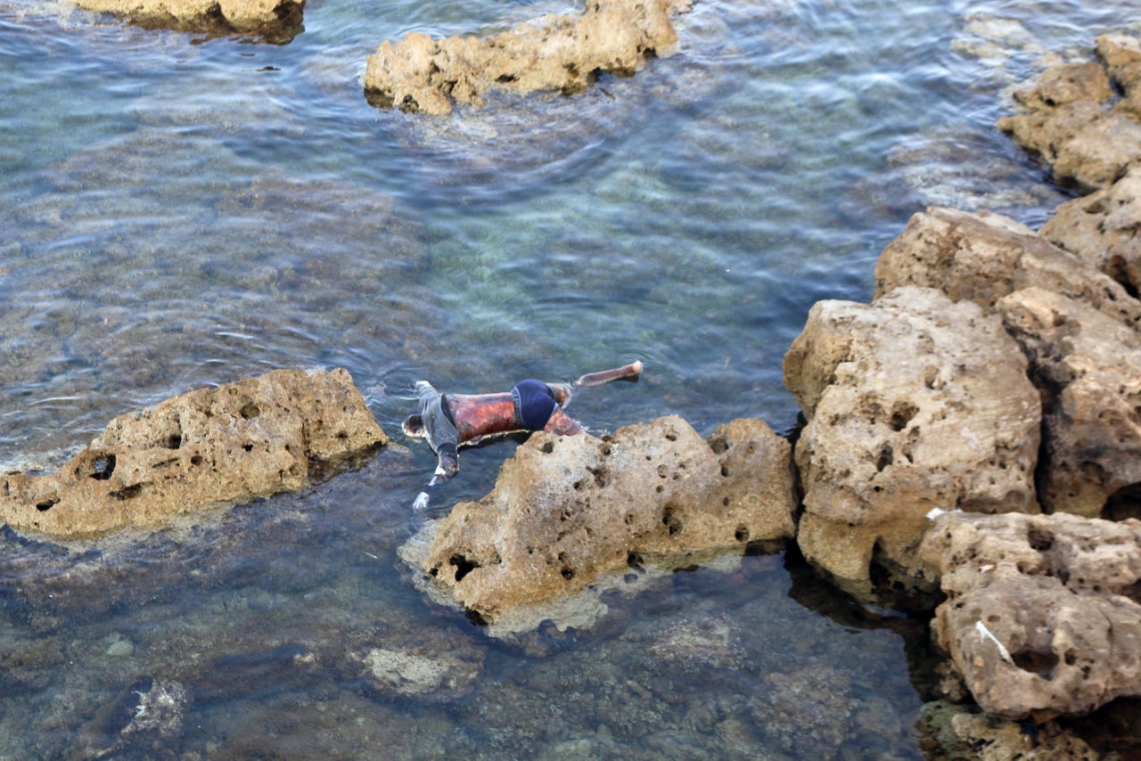 The dead body of a migrant that washed ashore is seen on the coast of Tajoura, east of Tripoli, Libya June 27.