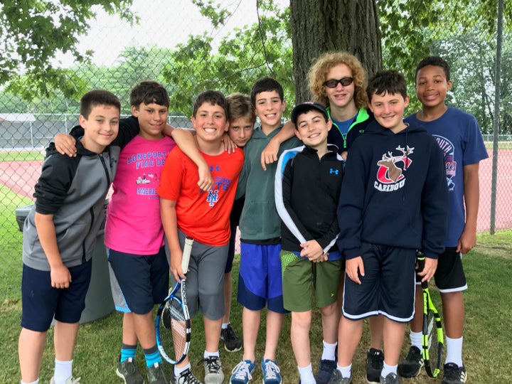 <p>It’s easy to embody the value of Friendship with friends like these! Daniel (center - grey sweatshirt, blue shorts) with his camp buddies.</p>