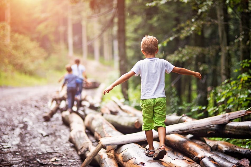 Children love places to clamber over like a rocky beach or challenges like climbing trees or jumping over streams. Challenge children to touch that tree and run back, hopscotch between the pavement cracks or run along the low wall.Â Â Â 