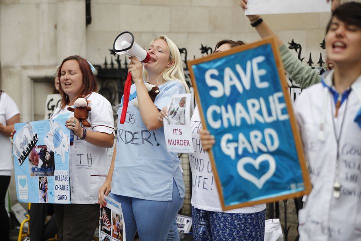 People gather outside the High Court in support of continued medical treatment for Charlie Gard in July