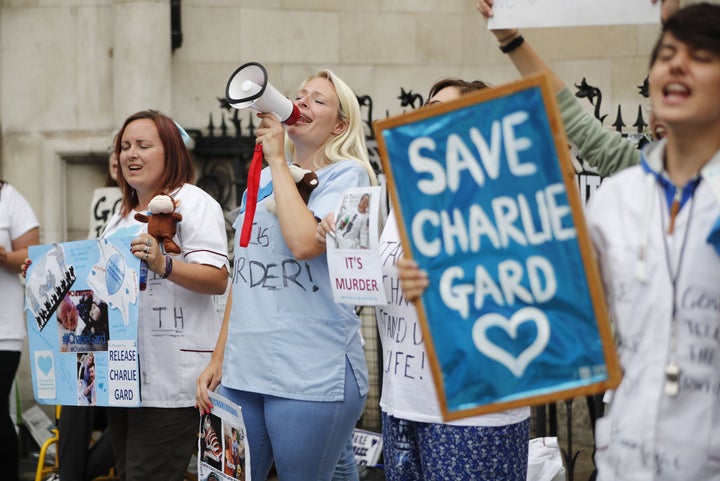 <strong>People gather outside the High Court in support of continued medical treatment for Charlie Gard in July</strong>