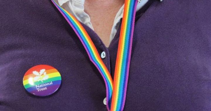 The National Trust has reversed a decision to bar volunteers from public-facing duties if they refuse to wear rainbow sexual equality symbols