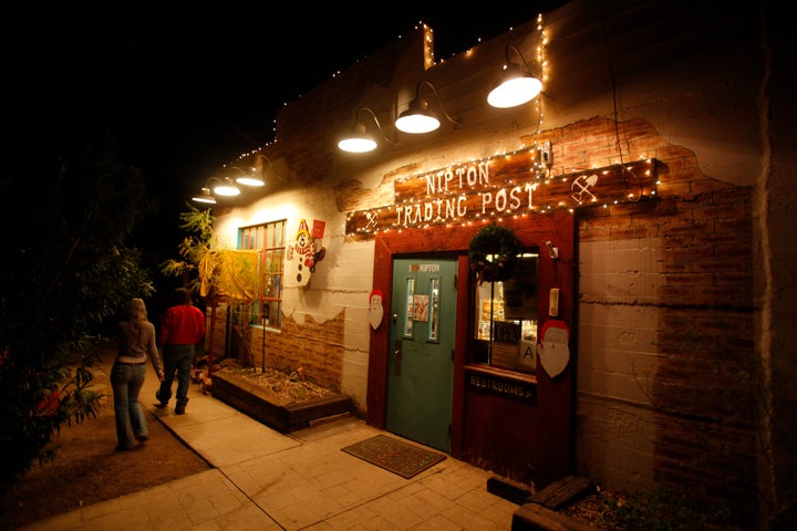 In this picture from 2012, lights at the Nipton Trading Post glow thanks to the 80 kilowatts of power generated by the small solar plant in Nipton, California.