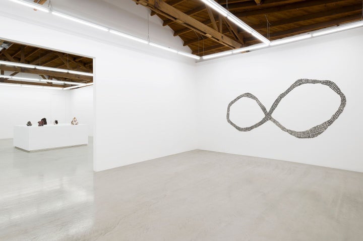 Installation shot of Julia Haft-Candell’s <em>Wall Infinity: Weave, </em>2017 (porcelain and underglaze) on the right at Parr