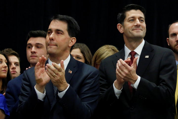 Wisconsin Gov. Scott Walker (R), left, and House Speaker Paul Ryan (R-Wis.) applaud during President Donald Trump's "thank you" rally in West Allis, Wisconsin, on Dec. 13, 2016.