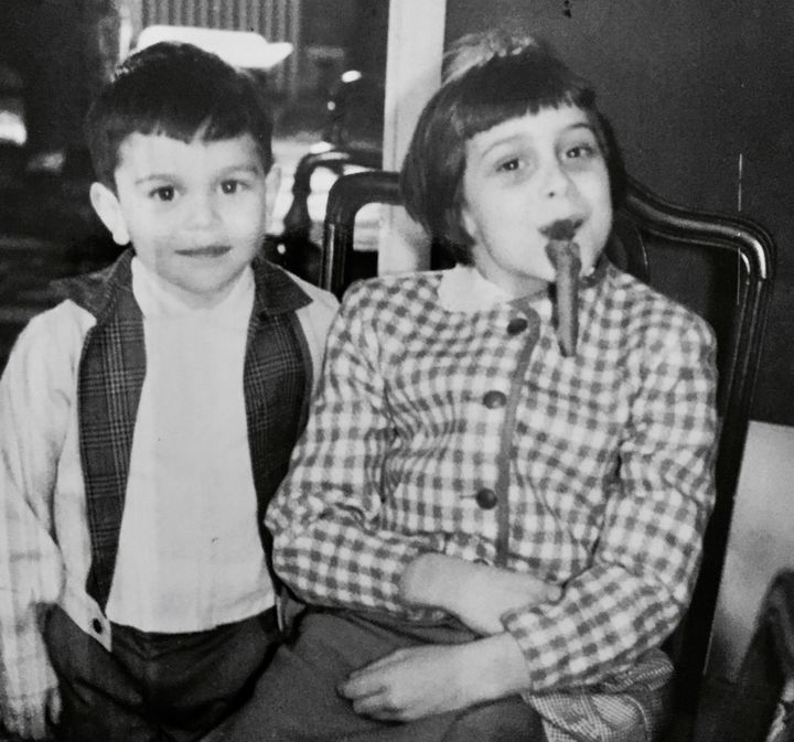 Circa 1962 with my brother Mark borrowing one of the men’s cigars while I escaped as the girls were doing the dishes!