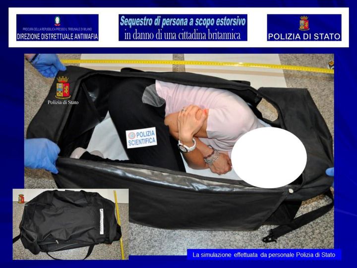 A person taking part in a reenactment by Italian police shows how Ayling was allegedly kept in a bag