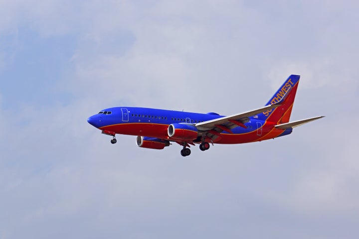 A woman seated by a man on a Southwest Airlines flight reported a man for sending disturbing text messages about molesting children, police said.