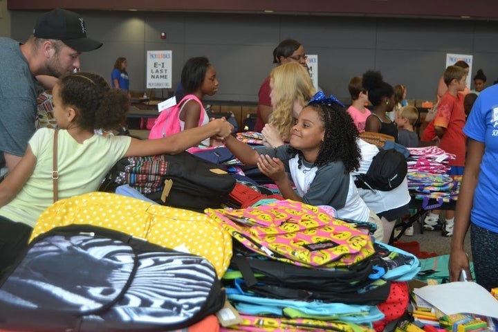 Amariyanna "Little Miss Flint" Copeny volunteers at Mott Community College for the school supply distribution in Flint, Michigan.