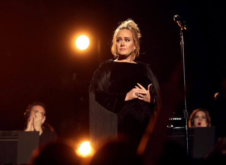 Adele took in a movie with children affected by a devastating London fire that killed around 80 people.