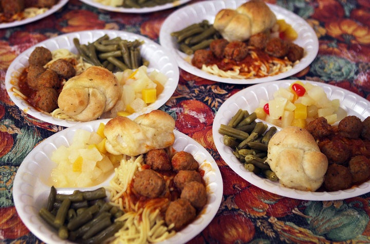 Students at the Boys and Girls Club in Greenville, Mississippi, attend a federally-funded afterschool program where they receive hot meals like spaghetti with meatballs, fruit cocktail, green beans, and a roll. Much of the funding for these programs comes from various grants from the Department of Education and Department of Agriculture. 