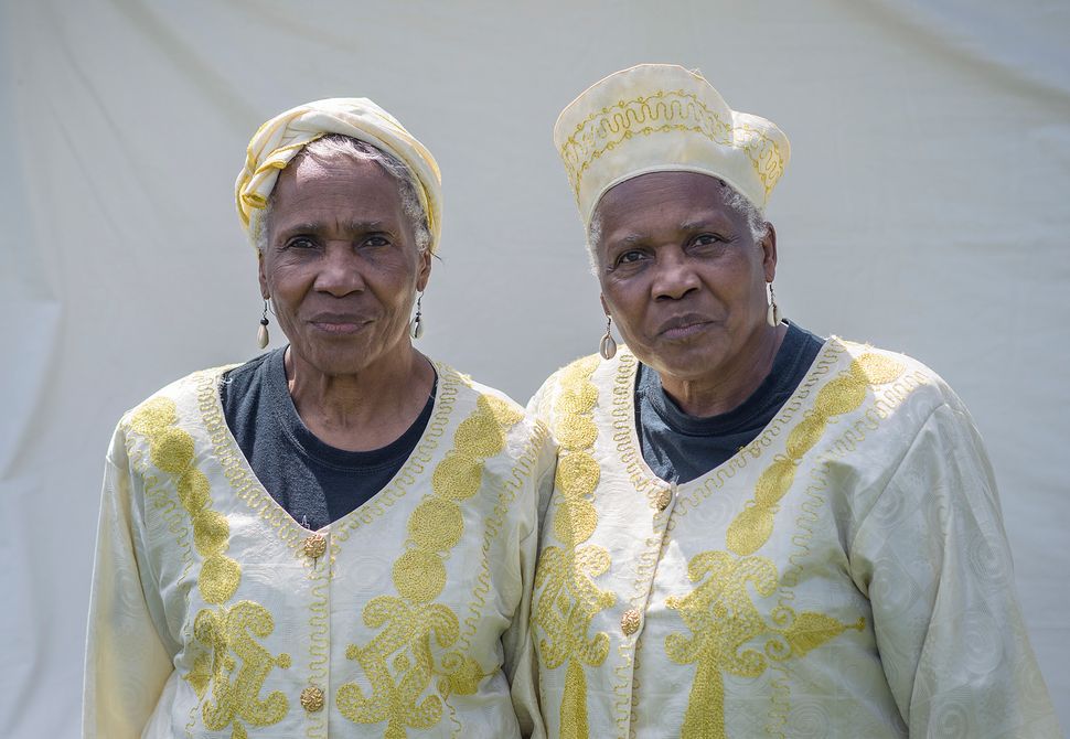 Arnette (left) and Anette Avery have their picture taken at the Twinsburg Twins Days Festival on Aug. 4.