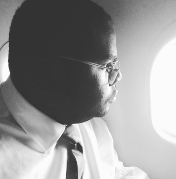 Rev. Williams while flying over Detroit, observing the lingering effects of the Detroit Rebellion of 1967.