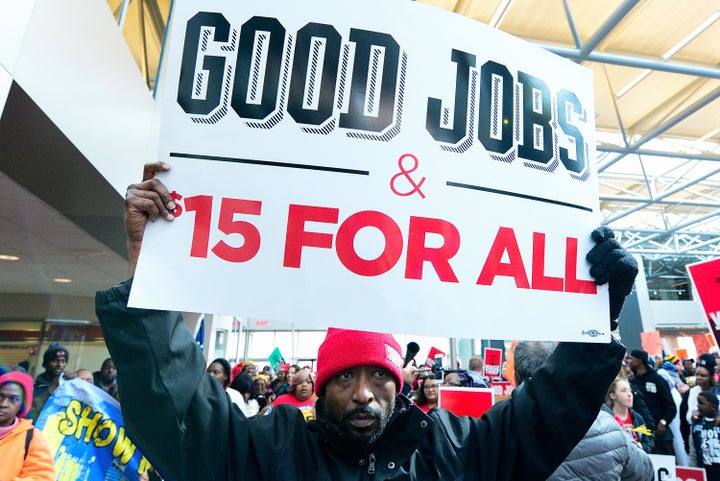 Fight for $15 supporters rally at the headquarters of Hardee's fast-food restaurants in St. Louis on Feb. 13. St. Louis had raised its minimum wage, effective in May, but a new state law will drop it back down to $7.70 an hour. 