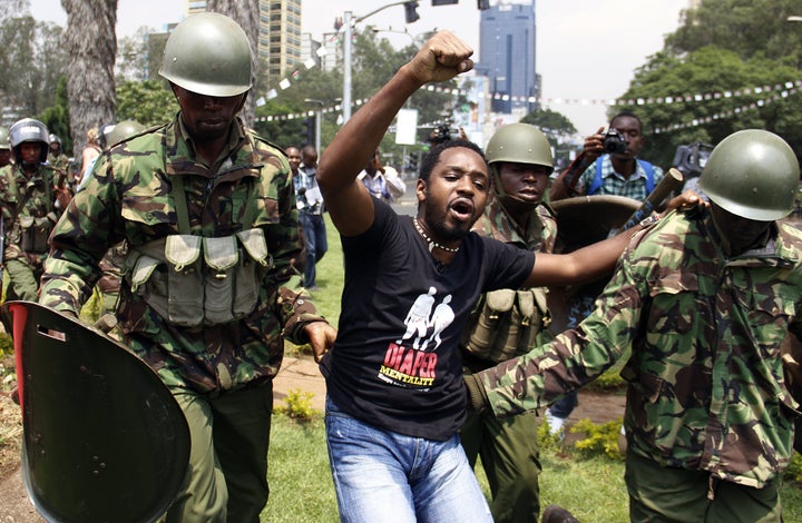 Kenyan activist Boniface Mwangi is arrested during a protest in Nairobi in 2014.&nbsp;