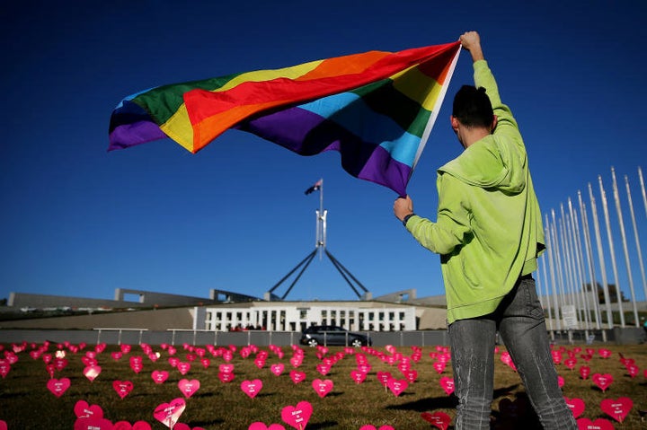 An activist supporting same sex marriage takes part in a protest in front of Australia's Parliament on Tuesday.