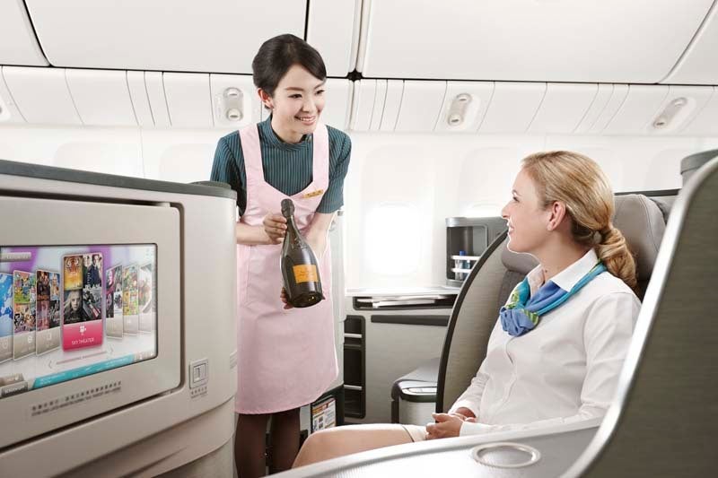 EVA Air flight attendants pour fine wines to accompany meals made with fresh, seasonal ingredients on all flights and adds ni