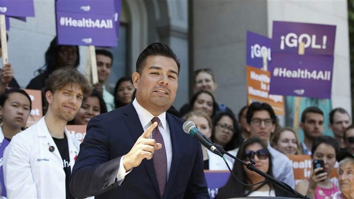 California state Sen. Ricardo Lara, a Democrat, speaks at a rally in Sacramento last year celebrating the expansion of Medica