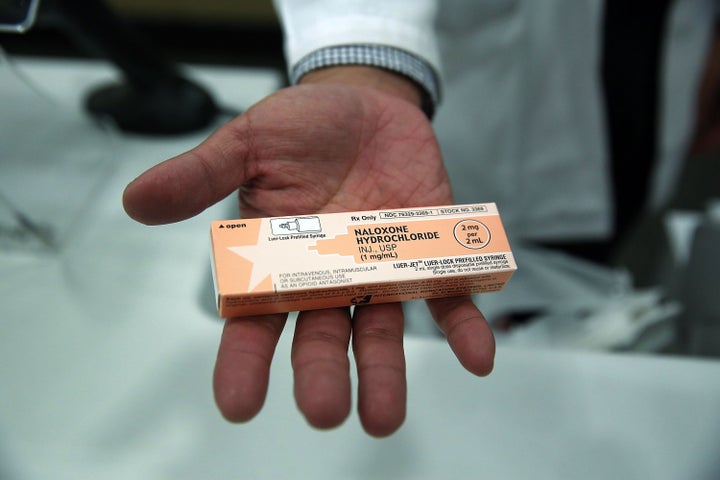  A pharmacist at a Walgreens store holds a box of the overdose antidote Naloxone Hydrochloride (Narcan) on February 2, 2