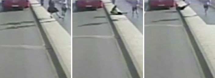A woman is seen being knocked into the path of an oncoming bus along Putney Bridge in west London on the morning of Friday, May 5.