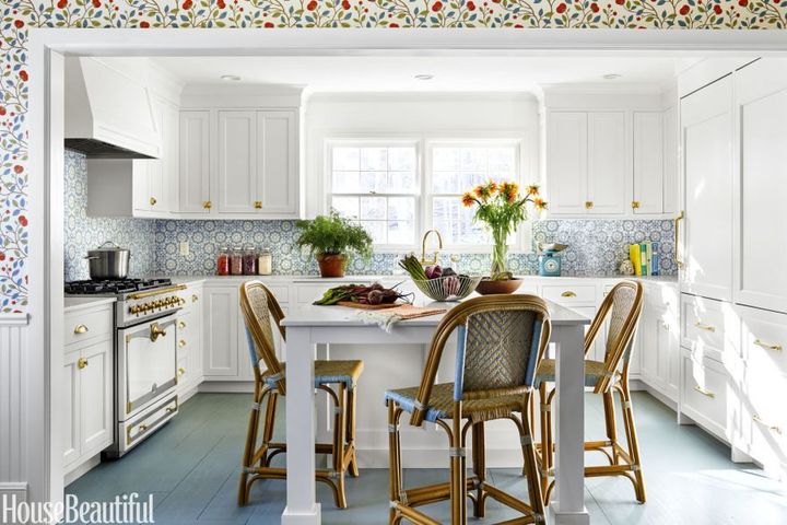 Above, rattan bistro stools add interesting texture to the kitchen of Anne Maxwell Foster of Tilton Fenwick, featured in House Beautiful.