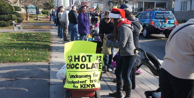 Selling hot chocolate at Santa Calus parade, to raise money for my volunteer trip