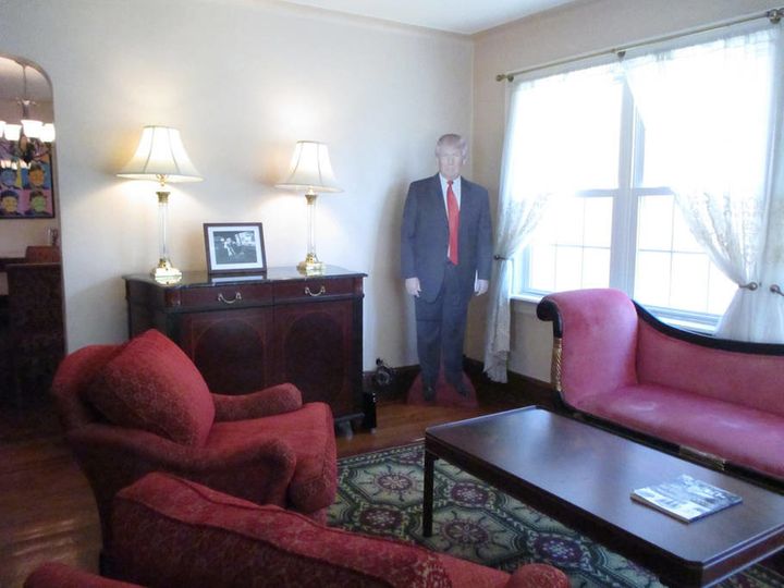 In the photo above, you can see two additional photographs and prints of Trump as well. 