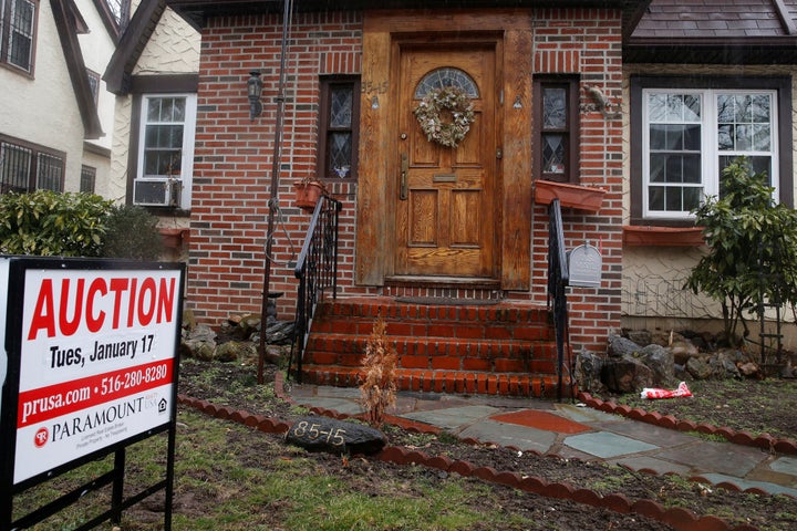 A childhood home of U.S. President-elect Donald Trump is seen with an auction sign in the Queens borough of New York on Jan.17. It was sold a few months later. 