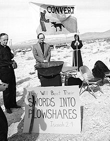 Members of Desert Lenten Experience hold a prayer vigil during the Easter period of 1982 at the entrance to the Nevada Test Site