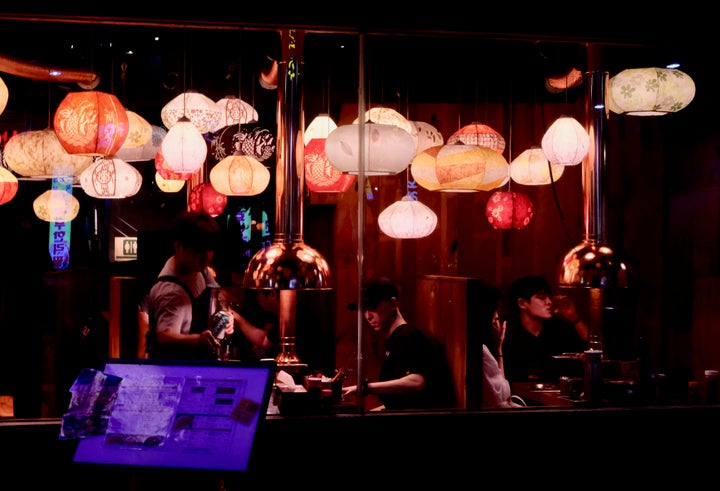 Seoul residents enjoy a late night dinner hours after U.S. President Donald Trump vowed to unleash “fire and fury” if North Korea threatened the United States.