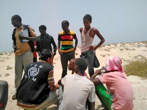 IOM staff assist Somali and Ethiopian migrants who were forced into the sea by smugglers.